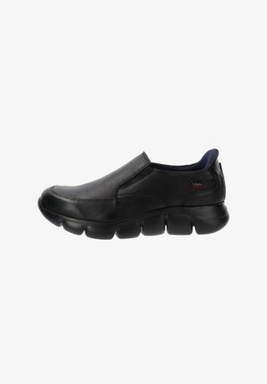 Zapato negro de cuero sin cordones con punta redonda y suela contorneada. Presenta paneles laterales elásticos y una plantilla acolchada para mayor comodidad.