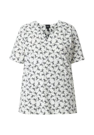 Blouse blanche à manches courtes avec un col en V subtil, présentant un motif abstrait de griffonnage noir sur toute la surface.