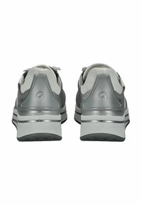 Gray athletic shoes with a smooth texture, featuring a contrasting white sole, reflective accents, and a distinctive heel tab design.