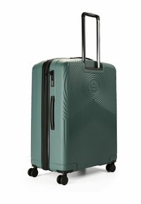 Hartschalenkoffer in mattem Türkis mit Wellenmuster, schwarzem Reißverschluss, Ziehgriff und vier schwarzen Rädern für Mobilität.