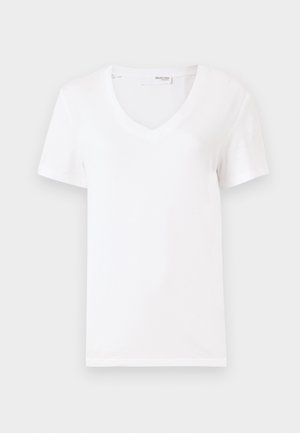 Camiseta branca de algodão com decote em V, mangas curtas e barra reta. O tecido parece suave e leve.