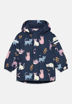Veste pour enfants de coloris bleu marine avec des imprimés amusants de chats en rose, bleu et blanc. Dotée d'une capuche, de poignets élastiques et d'une fermeture éclair à l'avant.