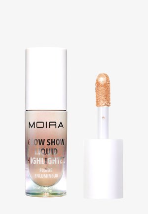 Enlumineur liquide Moira Glow Show avec un bouchon blanc et une baguette applicatrice montrant un produit scintillant de couleur champagne.