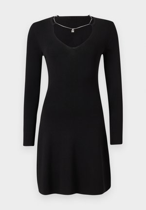 Black long-sleeve dress made of ribbed fabric, featuring a deep V-neckline and a slightly flared hem. Includes a silver necklace detail.