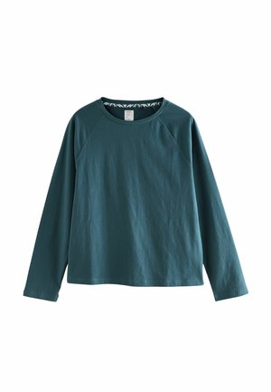 Teal pitkähihainen t-paita, joka on valmistettu puuvillasta ja jossa on pyöreä pääntie sekä raglan-hihat. Sisäkauluksessa on kuvioitu yksityiskohta.