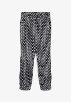 Spodnie w czarno-białe wzory z elastycznym paskiem w talii i marszczonymi mankietami, wykonane z lekkiego materiału w geometryczne wzory.