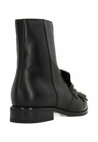 Black leather ankle boot with a rounded toe, mid-height shaft, and decorative metal accents on the side. Smooth texture and minimal stitching.