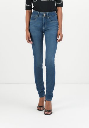 Skinny jeans in medium blue denim, featuring a high waist and two front pockets. Button and zipper closure with a smooth texture.