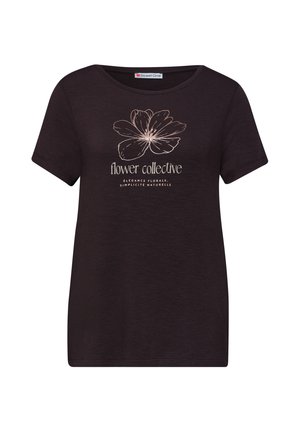 T-shirt noir à manches courtes avec une fleur dessinée en ligne beige et le texte « flower collective » avec un sous-titre en français en dessous sur le devant.