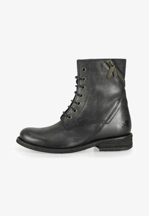 Black leather ankle boot with laces and zipper. Rounded toe, textured surface, and a low stacked heel. Features metal eyelets and logo detail.