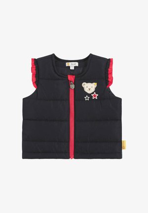 Chaleco negro sin mangas con acolchado y volantes rojos, cierre delantero con cremallera, oso bordado y estrellas, y una etiqueta de logo en el dobladillo.