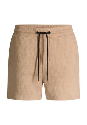 Beige strukturierte Shorts mit elastischem Bund und schwarzer Kordel vorne zum Binden.