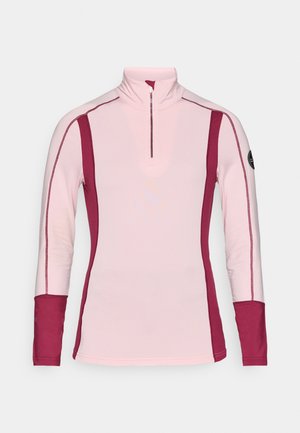 Light pink long-sleeve top with a quarter zip and dark pink side panels. Features flat seams and a logo on the left sleeve.