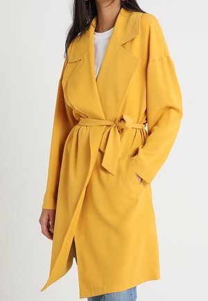 Yellow lightweight coat with a tie waist, notched collar, long sleeves, and side pockets. Smooth texture, falls below the knee.