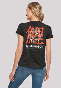 Black t-shirt featuring large red Japanese characters and koi fish design on the back. Short sleeves and a relaxed fit with a crew neckline.