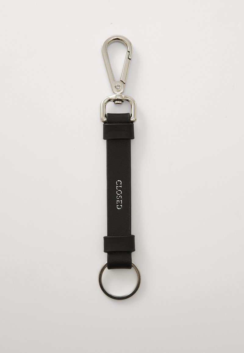 Black leather keychain with a silver metal clip, circular ring, and embossed "CLOSED" text on the strap. Smooth texture, minimalist design.