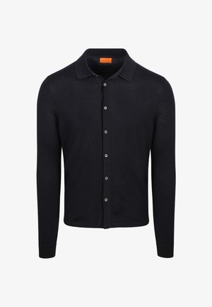 Donkerblauwe knopen cardigan met een kraag, lange mouwen en zilveren knopen. Gemaakt van zachte stof met een gladde textuur.