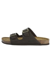 Brown leather slide sandal with two adjustable buckles, cork midsole, and textured rubber outsole. "REDSKINS" logo near the heel.