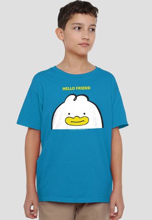 Boy wearing blue T-shirt with cartoon white chicken face and yellow text "HELLO FRIEND" on front, standing against plain background.