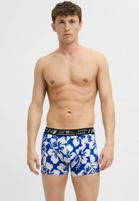 Blaue Boxershorts mit einem weißen Blumenmuster, schwarzem Bund mit Markenname, enganliegendem Schnitt und glatter Stoffoberfläche.