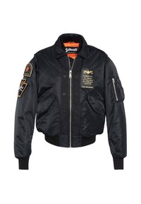 Giacca bomber in satin nero con polsini e orlo a costine, dotata di numerosi patch, chiusura frontale con zip e foderatura interna arancione.