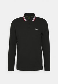 Svart långärmad polo tröja i bomull, med en ribbad krage i röd, grå och vit accent, samt en vit logotyp på bröstet.