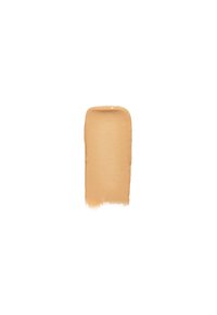 Beige vloeibare foundation swatch met een soepele, romige textuur; rechthoekige vorm met licht afgeronde hoeken; geen zichtbare glans of patronen.