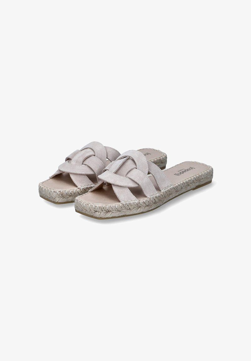 Flat slip-on sandals with a soft beige suede upper, features woven straps and a jute-wrapped sole, providing a casual aesthetic and texture.