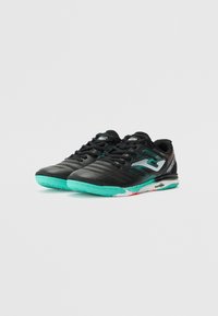 Black athletic shoes with a textured upper, turquoise sole, and white accents. Features a streamlined design and lace-up closure.