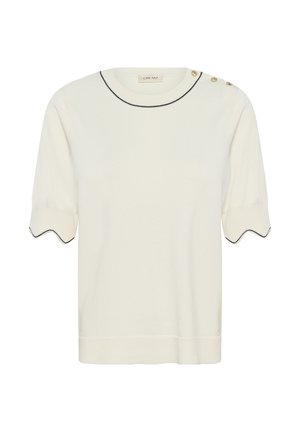 Haut en maille crème à manches courtes avec ourlets festonnés aux manches, bordure noire au niveau de l'encolure et des manches, et trois boutons dorés sur l'épaule gauche.