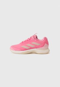 Pink athletic shoe with a smooth synthetic upper, white accents, and a cushioned sole. Features a lace-up closure and a textured heel.