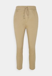 Pantalons de jogging khaki en tissu doux, avec une taille à cordon, deux poches avant et une coupe ajustée.