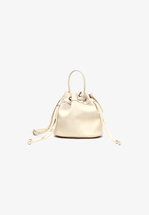 Cream-colored leather bucket bag with drawstring closure, single top handle, and long adjustable shoulder strap on a white background.