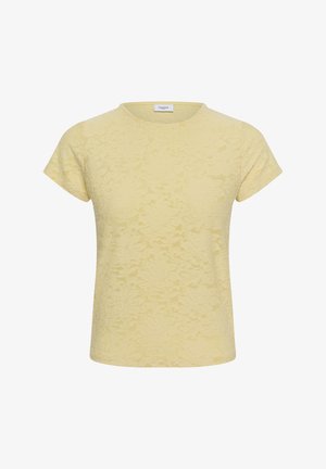 Blouse à manches courtes en dentelle florale texturée jaune pâle, col rond, coupe simple, sans boutons ni ornements visibles.