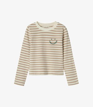 Camiseta de manga larga con rayas horizontales en tonos beige y crema, con un cuello redondo y un estampado en el pecho que dice "SIN COMPLICACIONES".