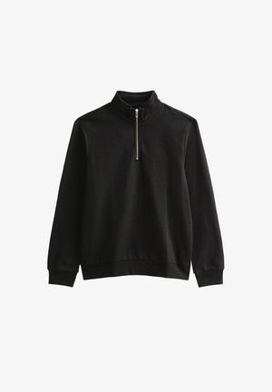 Felpa nera con collo alto e chiusura con mezza zip. Tessuto morbido e strutturato con polsini e orlo a costine.