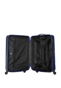 Blue hard-shell suitcase, open, featuring a black interior with zip compartments and straps. Smooth wheels and sturdy side handles.