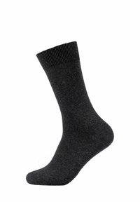 Czarna skarpetka z mieszanki bawełny z prążkowanym wykończeniem, o średniej grubości i gładkiej teksturze, pod kątem ukazująca kształt i detale wzoru.