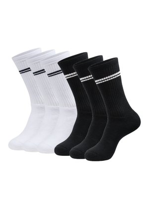 Baumwollcrew-Socken, zwei Paare in Weiß und zwei in Schwarz. Jedes Paar verfügt über eine gerippte Textur und kontrastierende Streifen am oberen Rand.