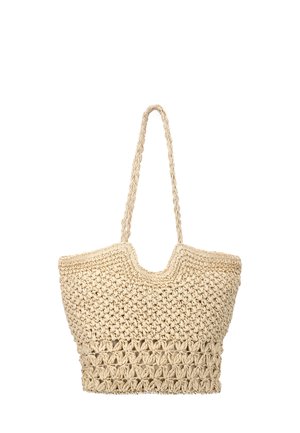 Beige vævet halm-tote taske med bred krop, indviklet strikkemønster og lange flettede håndtag til skulderbæring.