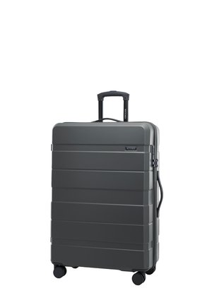 Valigia rigida grigia con scanalature verticali, manico estraibile e quattro ruote girevoli. Presenta una serratura e una finitura testurizzata.