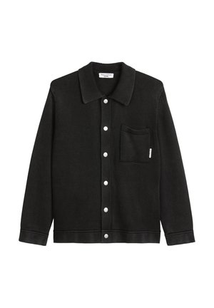 Black woven jacket with a collar, button front, and a chest pocket. Features white buttons and a textured fabric finish.