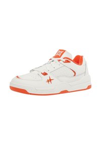 White sneaker with orange accents, featuring a perforated design, thick sole, and textured overlays. Lace-up closure with branded tongue.
