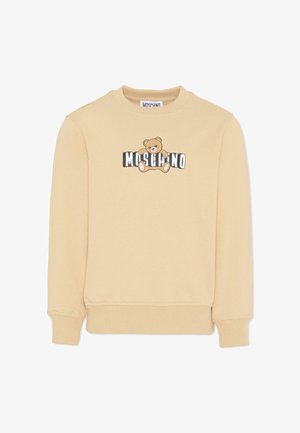 Jasnobeżowa bluza wykonana z miękkiej tkaniny. Z przodu znajduje się grafika przedstawiająca brązowego niedźwiedzia oraz czarny napis „Moschino”. Bluza ma ściągacze na mankietach i dole.