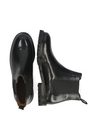 Pareja de botas Chelsea de cuero negro, una mostrando la vista superior y la otra el perfil lateral, con paneles laterales elásticos y una lengüeta.