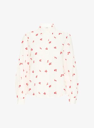 Balta ilgomis rankovėmis marškiniai su mygtukų apykakle, puoštas mažų raudonų lapų raštu. Minkšta medžiaga ir laisvas siluetas.