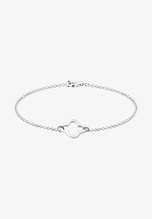 Sidabrinė grandinėlė su dekoratyviu tuščiaviduriu keturlapiu žavesiu, su klasikine omaro sagtimi ir lygia, poliruota paviršiumi.