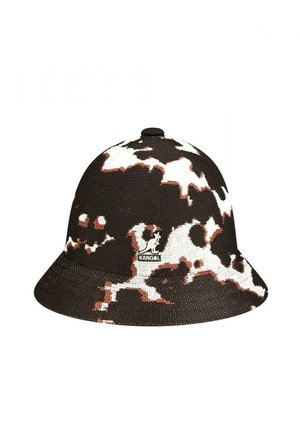 Bob imprimé vache noir et blanc avec un petit dessus rond et le logo Kangol sur le devant, au centre de la visière.