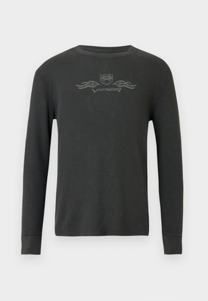 Dark gray long-sleeve thermal shirt with a ribbed texture. Features a small graphic logo at the chest and fitted cuffs.
