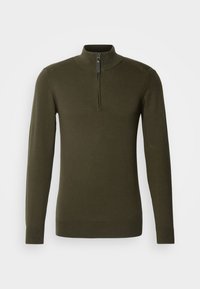 Pull-over vert olive à manches longues avec col montant, doté d'une fermeture éclair quart et de poignets et ourlet côtelés. Tissu doux et texturé.